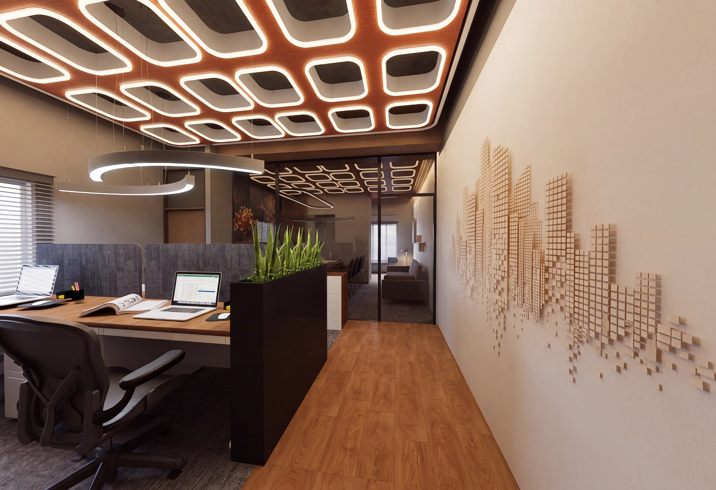 Workstations behind a dark planter under the coffered ceiling